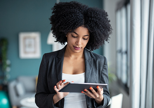 Increasing Black and Female Business Leadership woman working on laptop